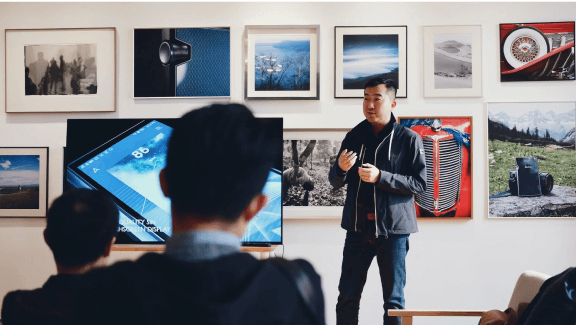 Photograph of 1 person talking in a pitch deck